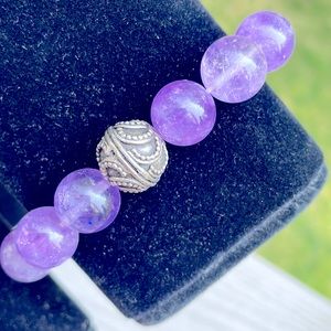 12mm Amethyst stretch bracelet with SS focus bead by Sky Jewelry. 7”